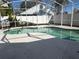 Kidney shaped swimming pool in backyard at 12131 Calaboose Ct, Orlando, FL 32828