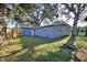 House exterior view, large backyard, mature trees at 1246 Margina Ave, Daytona Beach, FL 32114