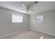 Spacious bedroom featuring two windows and a ceiling fan at 1246 Margina Ave, Daytona Beach, FL 32114