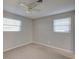 Simple bedroom with neutral walls and ceiling fan at 1246 Margina Ave, Daytona Beach, FL 32114