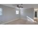 Spacious bedroom with neutral walls, ceiling fan, and carpet at 1246 Margina Ave, Daytona Beach, FL 32114