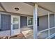 Screened porch with brick flooring and white door at 1246 Margina Ave, Daytona Beach, FL 32114