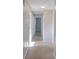 Bright hallway with neutral walls and carpet flooring at 1246 Margina Ave, Daytona Beach, FL 32114