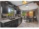 Modern kitchen with dark cabinetry and granite countertops at 1424 Cavendish Rd, Winter Park, FL 32789