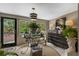 Sunroom with ample natural light, a stylish chest of drawers, and garden views at 1424 Cavendish Rd, Winter Park, FL 32789