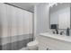 Modern bathroom with white vanity and shower at 15503 Amberbeam Blvd, Winter Garden, FL 34787