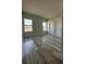 Bright bedroom with two windows and wood-look floors at 1619 Cumin Dr, Kissimmee, FL 34759