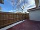 Small, private backyard with wood fence and gravel at 1627 Eagle Creek Cir # 36, Orlando, FL 32807