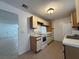 Bright kitchen features white appliances and ample cabinetry at 1627 Eagle Creek Cir # 36, Orlando, FL 32807