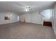 Bright living room featuring tile floors and a staircase at 1627 Eagle Creek Cir # 36, Orlando, FL 32807