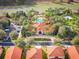 Community clubhouse, pool, and surrounding homes at 164 Sevilla Ave, Davenport, FL 33897
