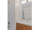 Clean bathroom with wood vanity and shower/tub combo at 164 Sevilla Ave, Davenport, FL 33897