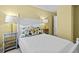 Bedroom with a full-size bed and floral decor at 164 Sevilla Ave, Davenport, FL 33897