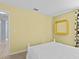 Bedroom with a full-size bed and gold framed mirror at 164 Sevilla Ave, Davenport, FL 33897