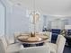 Round dining table with four chairs, located near the living room at 164 Sevilla Ave, Davenport, FL 33897
