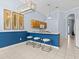 Bright kitchen with light wood cabinets, a breakfast bar, and tile flooring at 164 Sevilla Ave, Davenport, FL 33897