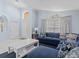 Bright living room with an L-shaped sofa, and entryway view at 164 Sevilla Ave, Davenport, FL 33897