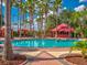 Resort-style pool with cabanas and lounge chairs at 164 Sevilla Ave, Davenport, FL 33897