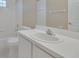 Clean bathroom with single vanity, oval sink and a bathtub at 16946 Woodcrest Way, Clermont, FL 34714