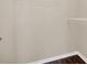 Walk-in closet with wire shelving and hanging rod at 16946 Woodcrest Way, Clermont, FL 34714
