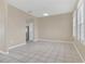 Simple dining room with tiled floors and kitchen access at 16946 Woodcrest Way, Clermont, FL 34714