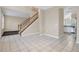 Tile floor dining area with access to kitchen and staircase at 16946 Woodcrest Way, Clermont, FL 34714