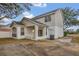 Two-story house with screened patio and AC unit at 16946 Woodcrest Way, Clermont, FL 34714