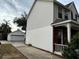 House exterior showcasing a two-car garage and driveway at 16946 Woodcrest Way, Clermont, FL 34714