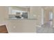 Kitchen with breakfast bar, white cabinets, and stainless steel appliances at 16946 Woodcrest Way, Clermont, FL 34714
