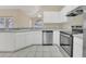 Bright kitchen features stainless steel appliances and ample cabinetry at 16946 Woodcrest Way, Clermont, FL 34714