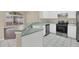 Modern kitchen with stainless steel appliances and breakfast bar at 16946 Woodcrest Way, Clermont, FL 34714