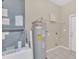 Laundry room with washer/dryer hookups and extra storage at 16946 Woodcrest Way, Clermont, FL 34714