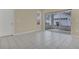 Living area with tile floors and sliding doors to backyard at 16946 Woodcrest Way, Clermont, FL 34714