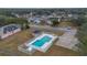 Community pool with surrounding fenced area at 16946 Woodcrest Way, Clermont, FL 34714