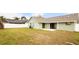 View of the home's backyard and a white fence along the perimeter at 1747 Lady Slipper Cir, Orlando, FL 32825