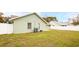 The backyard has a grassy lawn and a white fence at 1747 Lady Slipper Cir, Orlando, FL 32825