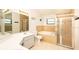 Bathroom featuring double sinks, bathtub and separate glass shower at 1747 Lady Slipper Cir, Orlando, FL 32825