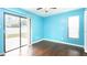 Bedroom with light blue walls and wood flooring at 1747 Lady Slipper Cir, Orlando, FL 32825