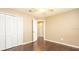 Bedroom with wood floors and neutral decor at 1747 Lady Slipper Cir, Orlando, FL 32825