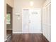 Bright entryway with wood-look floors and built-in storage at 1747 Lady Slipper Cir, Orlando, FL 32825