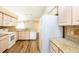 Bright kitchen featuring granite countertops, stainless steel appliances, and light wood cabinets at 1747 Lady Slipper Cir, Orlando, FL 32825