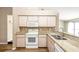 The kitchen features granite countertops, stainless steel appliances, and light wood cabinets at 1747 Lady Slipper Cir, Orlando, FL 32825