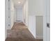 Clean hallway with carpeted floors and neutral walls at 211 Pendant Ct, Kissimmee, FL 34747