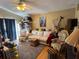 Living room with beige couch and patterned arm chair at 2864 Copper Ridge Ct, Lake Mary, FL 32746