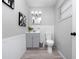 Small bathroom with grey vanity and white tile at 2911 Dudley Dr, Bartow, FL 33830