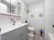 Updated bathroom with grey vanity and tiled walls at 2911 Dudley Dr, Bartow, FL 33830