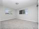 Spacious bedroom with two windows and carpet flooring at 2911 Dudley Dr, Bartow, FL 33830