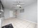 Bright sunroom with tile flooring, ceiling fan, and window bench at 2911 Dudley Dr, Bartow, FL 33830
