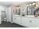 Spacious bathroom with double vanity and dark tile floors at 355 Carriage Way Ct, Oviedo, FL 32765