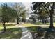 Neighborhood park with playground, benches, and walking path at 355 Carriage Way Ct, Oviedo, FL 32765
